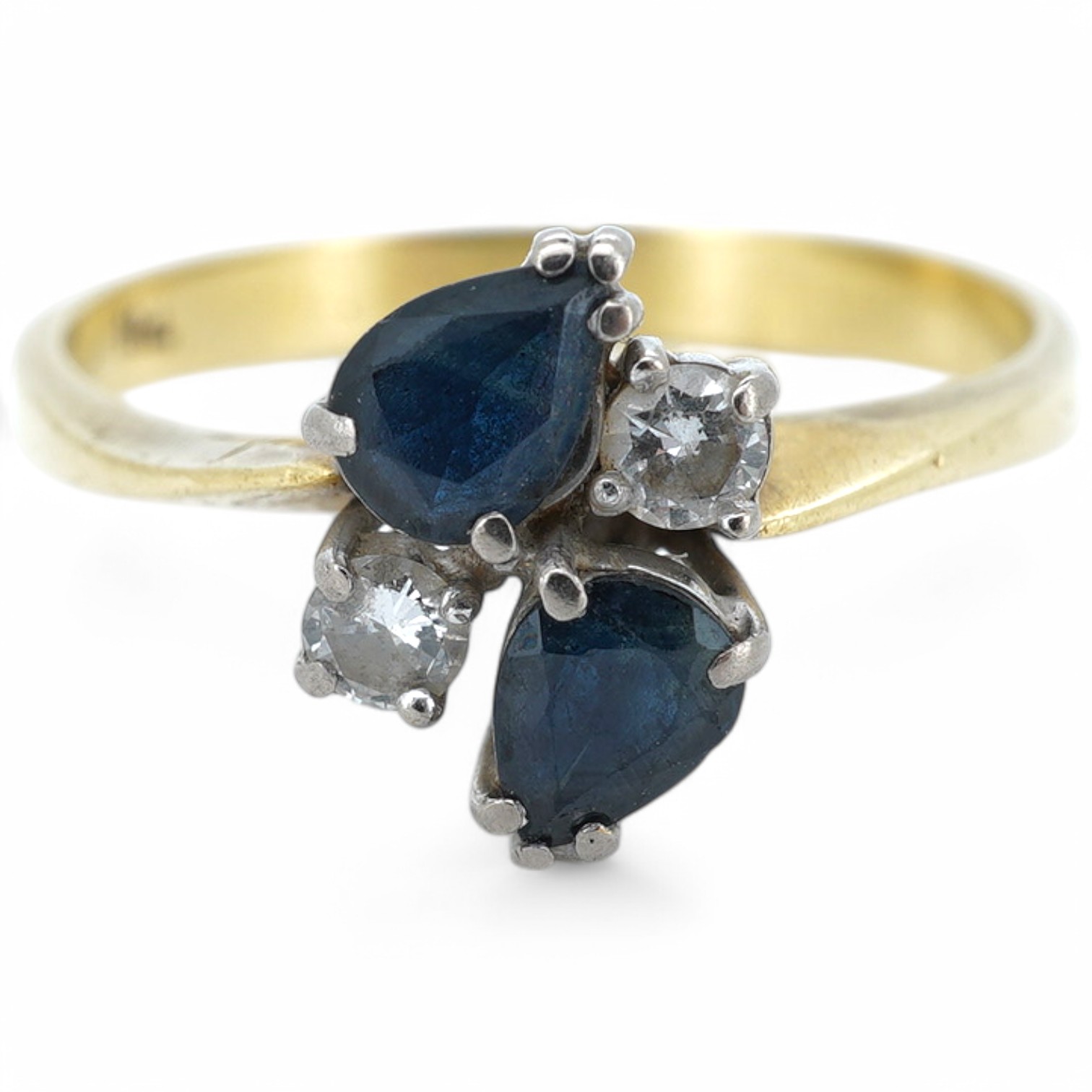 An 18ct two stone pear cut sapphire and two stone diamond cluster set ring, size P/Q, gross weight 3 grams. Condition - fair